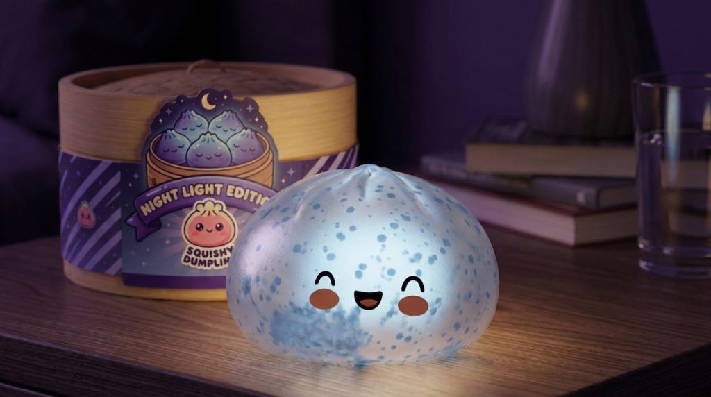 Dumpling Squishy Bleu Glacé Sparkle met Glitter in zijn kawaii omgeving